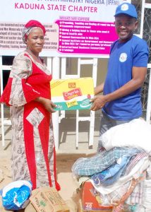 Presentation of Food-Clothing items to Dr.Elizabeth Afuwape ProprietormADONAI Children Home by the coordinator BARTH UDUMAGA un-behalf of IFFM members Kaduna Chapter
